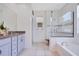 Bright bathroom with granite countertops, walk in shower and separate tub at 9426 Launch Point Rd, Orlando, FL 32832