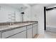 Bathroom featuring double vanity sinks, granite countertop and tiled floor at 9426 Launch Point Rd, Orlando, FL 32832