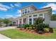 Beautiful two-story home showcasing lush landscaping and a well-maintained lawn at 9426 Launch Point Rd, Orlando, FL 32832