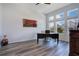 Home office with modern desk, beautiful windows, and stylish decor at 9426 Launch Point Rd, Orlando, FL 32832
