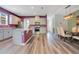 Bright, open kitchen featuring stainless appliances, a center island, and ample counter space perfect for cooking and entertaining at 9426 Launch Point Rd, Orlando, FL 32832