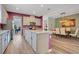 Spacious kitchen and dining area featuring an island, stainless steel appliances, and plenty of room to cook and entertain at 9426 Launch Point Rd, Orlando, FL 32832