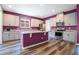 Stylish kitchen featuring a center island, stainless appliances, and modern white cabinets at 9426 Launch Point Rd, Orlando, FL 32832