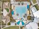 Aerial view of the pool, surrounding lounge areas and nearby playground in the community at 9426 Launch Point Rd, Orlando, FL 32832