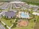 Aerial view of the community amenities, including a pool, clubhouse, playground and other outdoor features at 9846 Palmetto Dunes Ct, Orlando, FL 32832