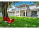 Expansive backyard features a lush lawn, swing set, open patio, and covered balcony, perfect for outdoor living at 9846 Palmetto Dunes Ct, Orlando, FL 32832