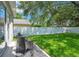 Charming backyard with well-kept lawn, privacy fence, and outdoor seating area at 9846 Palmetto Dunes Ct, Orlando, FL 32832