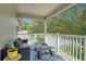 Balcony with patio furniture and a view of surrounding trees and neighborhood at 9846 Palmetto Dunes Ct, Orlando, FL 32832