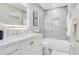 Modern bathroom with tiled shower, marble countertop vanity, and decorative accents at 9846 Palmetto Dunes Ct, Orlando, FL 32832