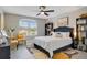 Comfortable bedroom with a large window, stylish furnishings, and plenty of natural light at 9846 Palmetto Dunes Ct, Orlando, FL 32832
