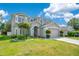 Beautiful home with lush landscaping and a well-maintained lawn at 9846 Palmetto Dunes Ct, Orlando, FL 32832