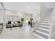Inviting living area with neutral tones and staircase at 9846 Palmetto Dunes Ct, Orlando, FL 32832