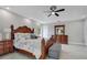 The main bedroom includes a patterned duvet cover, and a furniture set with a matching dresser at 9846 Palmetto Dunes Ct, Orlando, FL 32832