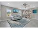 Inviting office space with a comfortable sofa, shuttered windows, and built-in shelving at 9846 Palmetto Dunes Ct, Orlando, FL 32832