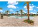Relaxing community pool with lush palm trees and plenty of space for lounging and enjoying the sunshine at 9846 Palmetto Dunes Ct, Orlando, FL 32832