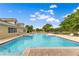 Community pool with a hot tub and plenty of seating at 9846 Palmetto Dunes Ct, Orlando, FL 32832