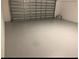 Spacious and empty garage space, perfect for parking or storage at 12337 Turtle Grass Dr, Orlando, FL 32824