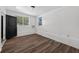 A sunlit bedroom with updated floors, offering a comfortable and modern living space at 1257 N Pine Hills Rd, Orlando, FL 32808