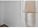 A bright hallway with a white wall and a shelf, adding storage and a touch of decor at 1257 N Pine Hills Rd, Orlando, FL 32808