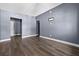 Spacious living room with hardwood flooring, light gray walls, and ample natural light at 1257 N Pine Hills Rd, Orlando, FL 32808