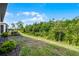 Backyard view showcasing the natural landscaping surrounding the property at 1388 Lombardi Ct, Kissimmee, FL 34759