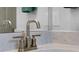 Close-up of a bathroom sink featuring a modern faucet and quartz countertop, creating a stylish and functional space at 1388 Lombardi Ct, Kissimmee, FL 34759
