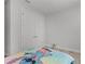 A simple bedroom with a themed bedspread and a closet at 1388 Lombardi Ct, Kissimmee, FL 34759