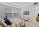 Inviting bedroom with a comfortable bed, modern dresser, large window, and a relaxing atmosphere at 1388 Lombardi Ct, Kissimmee, FL 34759