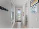 Bright entryway with wood-look tile flooring and decorative glass door at 1388 Lombardi Ct, Kissimmee, FL 34759