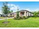 Beautiful home exterior showcasing lush green lawn and manicured landscaping at 1388 Lombardi Ct, Kissimmee, FL 34759