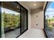 Screened-in patio with sliding glass doors offering views of the greenery at 1388 Lombardi Ct, Kissimmee, FL 34759
