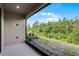 Spacious patio with a beautiful view of the lush landscaping at 1388 Lombardi Ct, Kissimmee, FL 34759