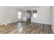 Spacious living room with hardwood floors, large windows, and decorative columns at 148 Conch Dr, Kissimmee, FL 34759