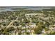 Real estate image showing the neighborhood location near a school, lake and residences from an aerial view at 2114 Geigel Ct, Orlando, FL 32806