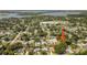 Aerial view of the property and surrounding neighborhood, highlighting its proximity to a lake at 2114 Geigel Ct, Orlando, FL 32806