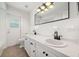 Bright bathroom with a double vanity, large mirror, and lots of counterspace with a tiled floor at 2114 Geigel Ct, Orlando, FL 32806