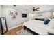 Cozy bedroom with hardwood floors, light gray walls, a ceiling fan and natural light from the window at 2114 Geigel Ct, Orlando, FL 32806