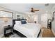 Spacious bedroom with hardwood floors, soft lighting, and a comfortable setting with a ceiling fan at 2114 Geigel Ct, Orlando, FL 32806