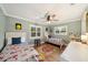 Playful ' bedroom with two beds, hardwood floors, a ceiling fan, and lots of natural light at 2114 Geigel Ct, Orlando, FL 32806