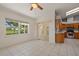 The dining room features an open floor plan, large window, and sliding door leading to the kitchen at 21144 Royal St Georges Ln, Leesburg, FL 34748