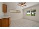 Open dining area features bright neutral tones, tiled floor and views of the fenced backyard at 21144 Royal St Georges Ln, Leesburg, FL 34748