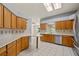 Bright kitchen with modern appliances, skylights, and an adjacent dining area at 21144 Royal St Georges Ln, Leesburg, FL 34748
