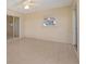 Sunroom featuring tile floors, windows, and a sliding glass door at 21144 Royal St Georges Ln, Leesburg, FL 34748