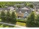Aerial view of colorful townhomes featuring well-maintained landscaping at 2280 San Vital Dr # 101, Kissimmee, FL 34741