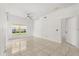 Well-lit empty living room with tile floors, ceiling fan and window at 2280 San Vital Dr # 101, Kissimmee, FL 34741