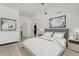 Well-lit main bedroom with ensuite bath, neutral decor and decorative art at 2280 San Vital Dr # 101, Kissimmee, FL 34741