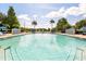 A pristine community pool with inviting blue water and comfortable lounge seating at 2280 San Vital Dr # 101, Kissimmee, FL 34741