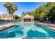 The beautiful community pool with clear water and lounge chairs offers a relaxing atmosphere at 2280 San Vital Dr # 101, Kissimmee, FL 34741