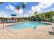 Community pool with lounge chairs, playground and shade umbrellas create a relaxing and enjoyable outdoor space at 2280 San Vital Dr # 101, Kissimmee, FL 34741