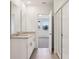 Bathroom featuring double sinks, granite countertops, and glass door shower at 2365 White Tail St, Davenport, FL 33837